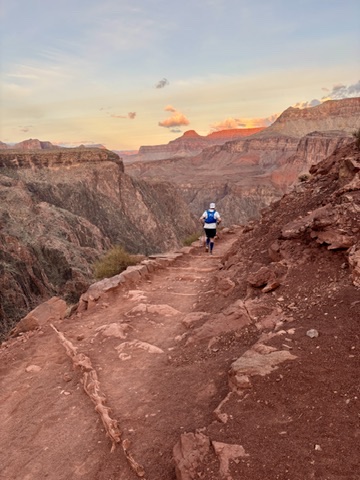 Trail runner at Grand Canyon sunset